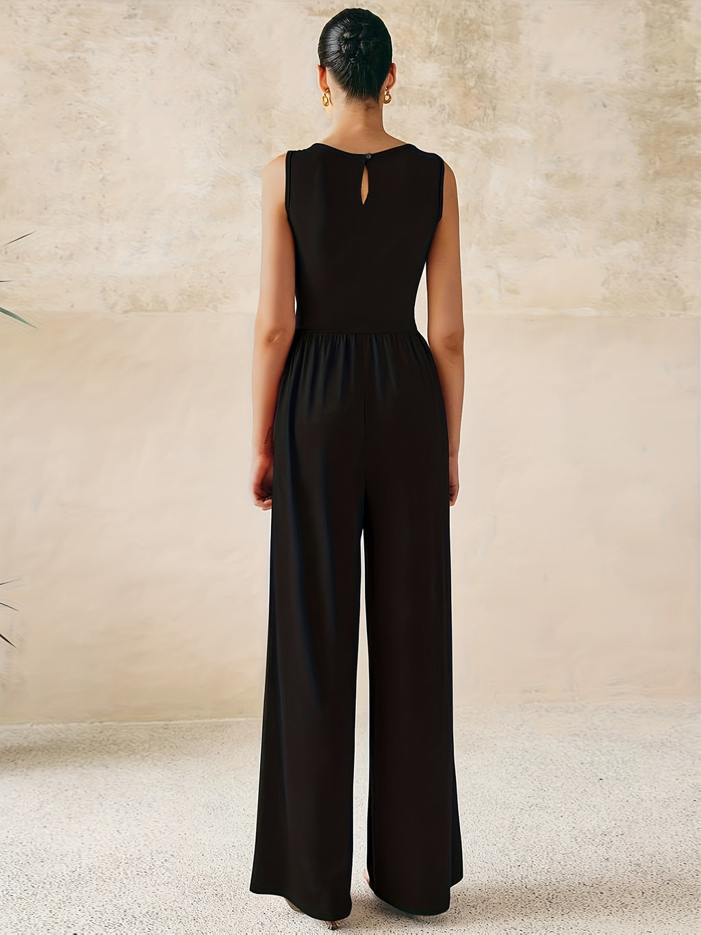 Combinaison noir pantalon large chic sans manche