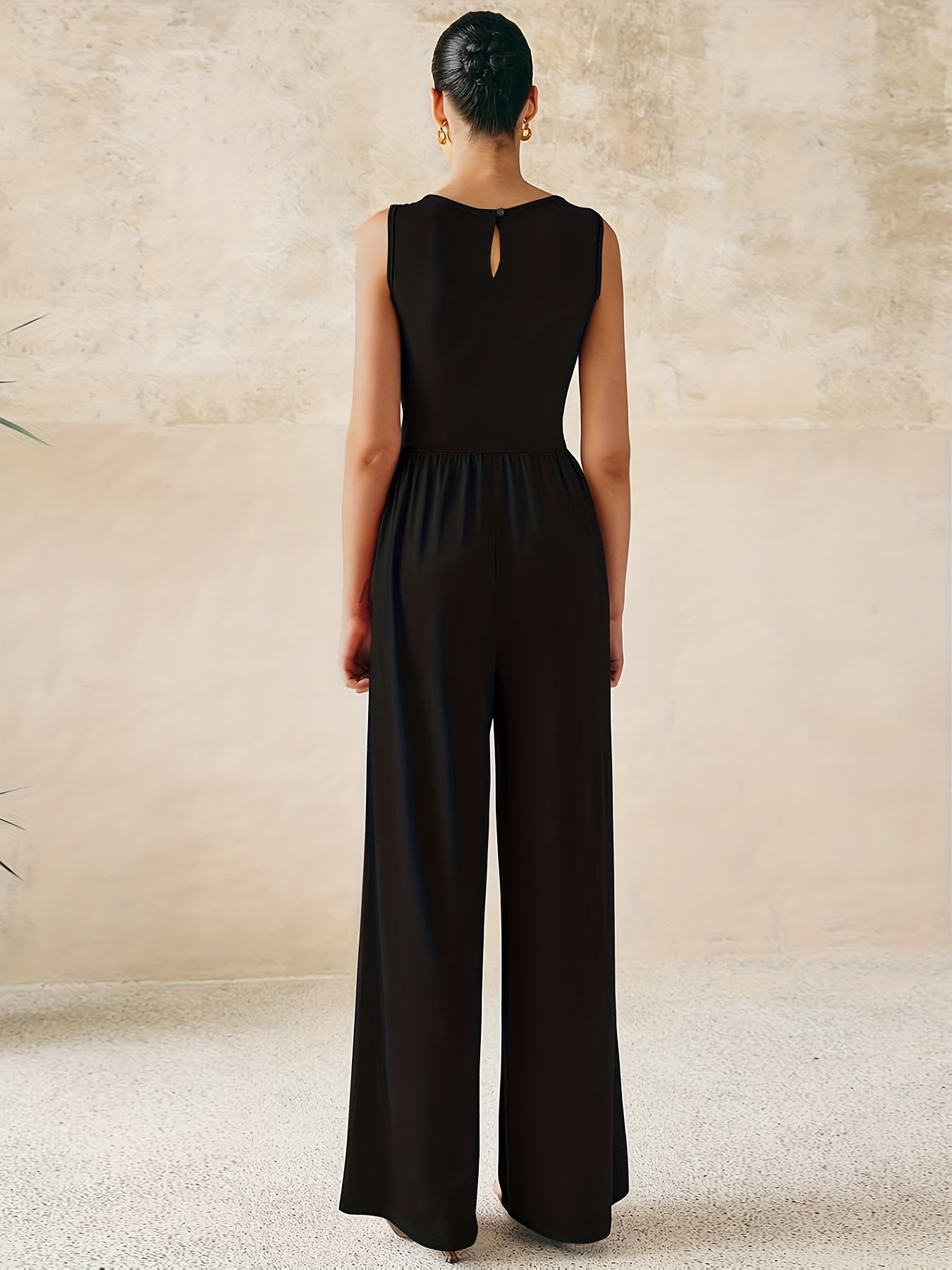 Combinaison noir pantalon large chic sans manche