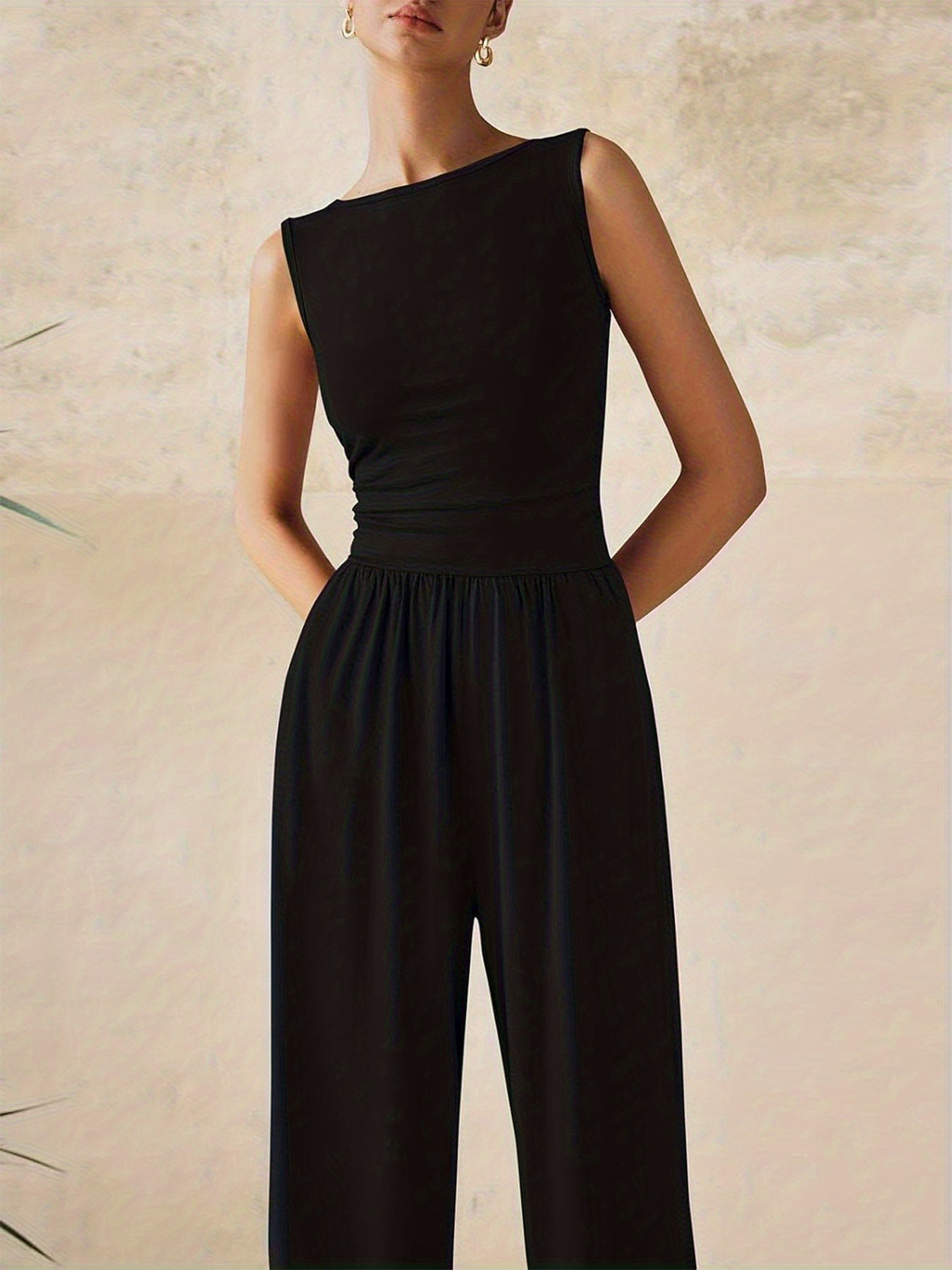 Combinaison noir pantalon large chic sans manche